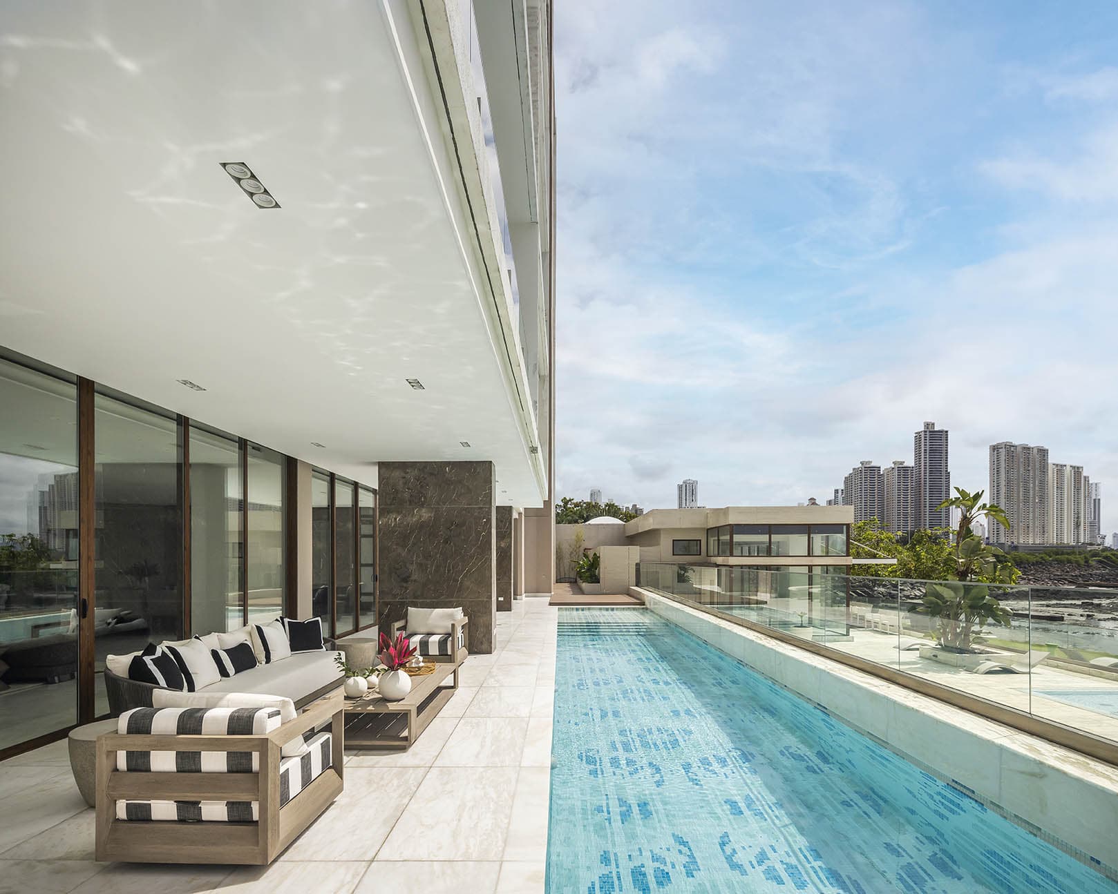 Poolside lounge beside the lap pool at The Residences