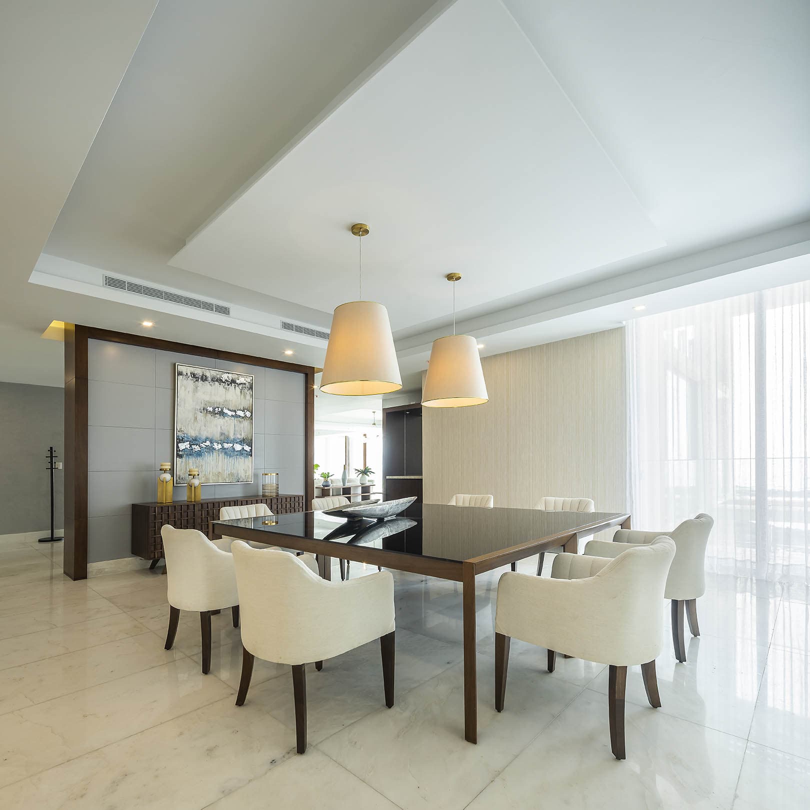 Dining room with a dark wood table at The Residences