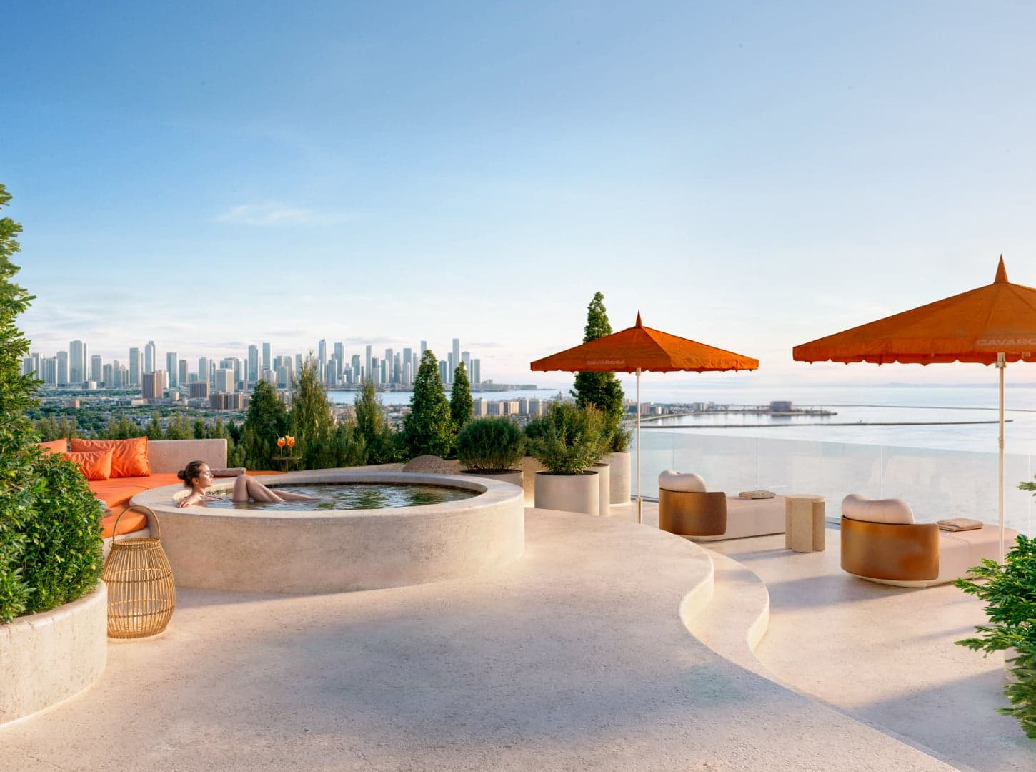 Rooftop jacuzzi with orange umbrellas and city views at Cavarosa