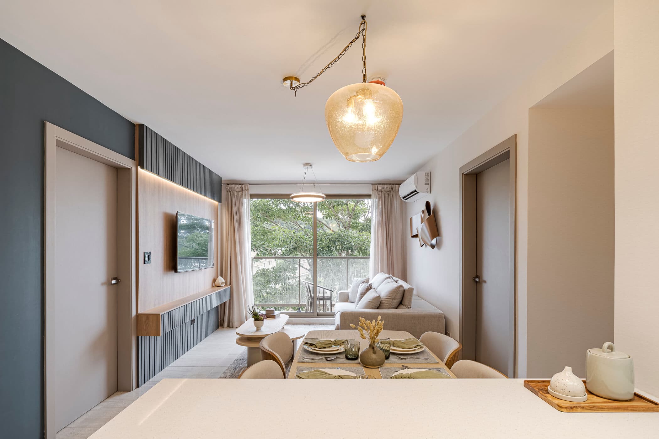 Living and dining area with balcony view in a Parterre apartment