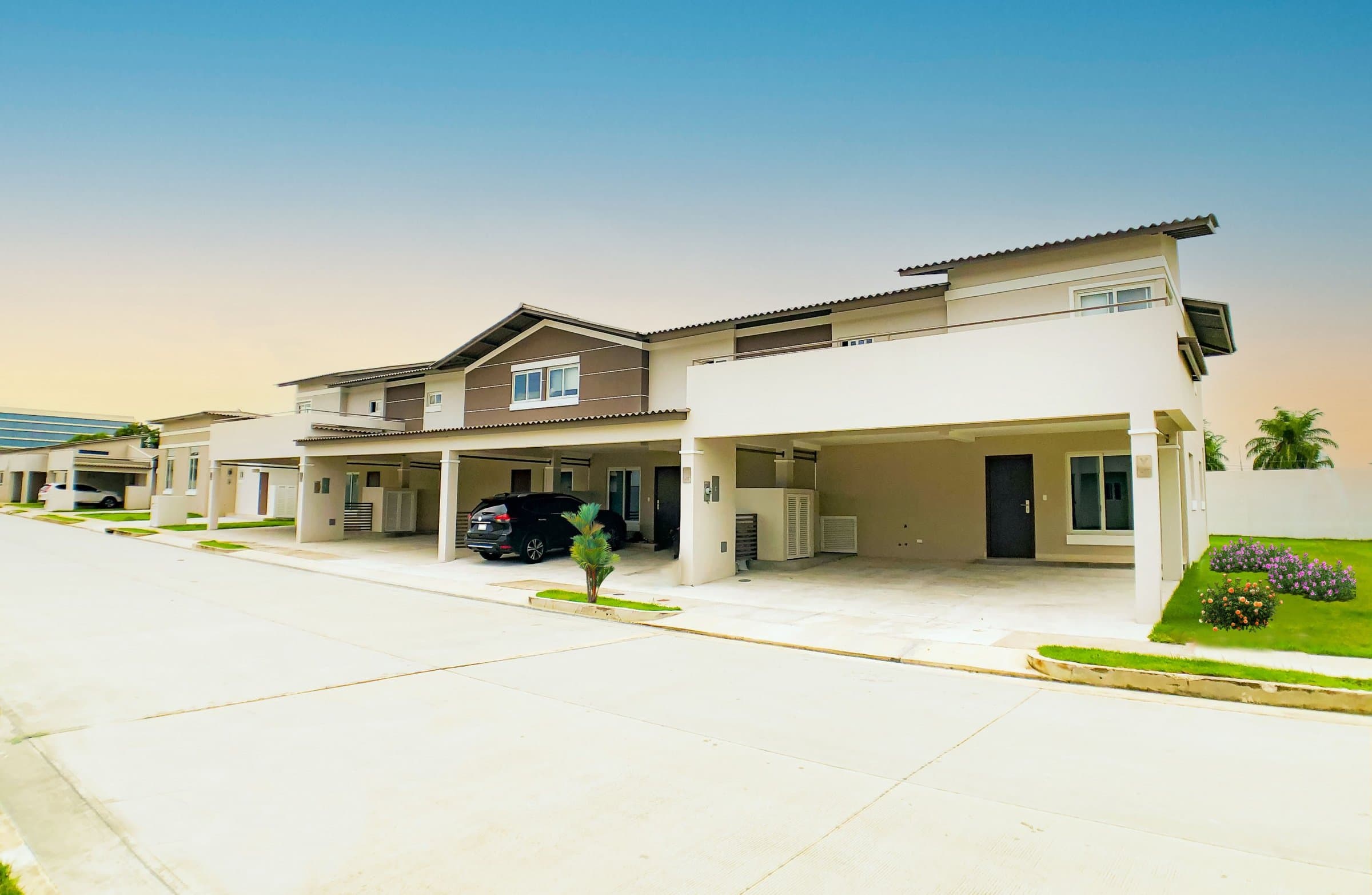 Two-story Villasur Residences townhomes with carports in Costa Sur, Panama City