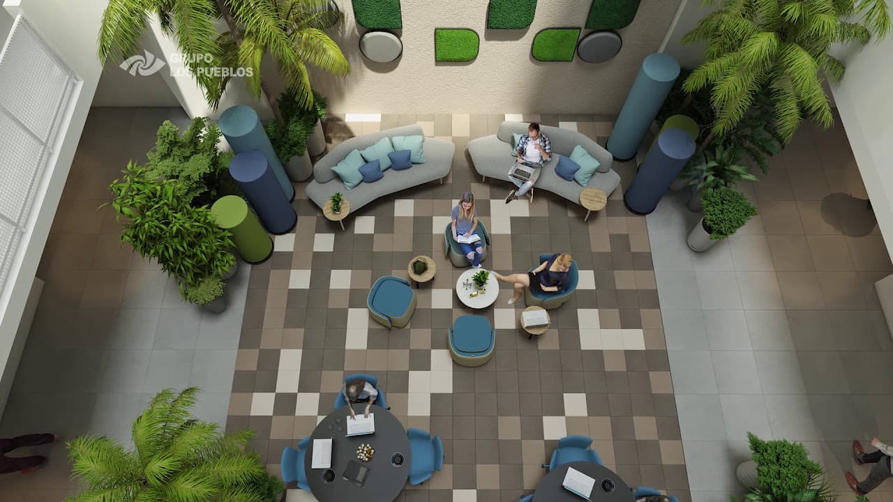 Overhead view of the Coco Place rooftop lounge with sofas and planters