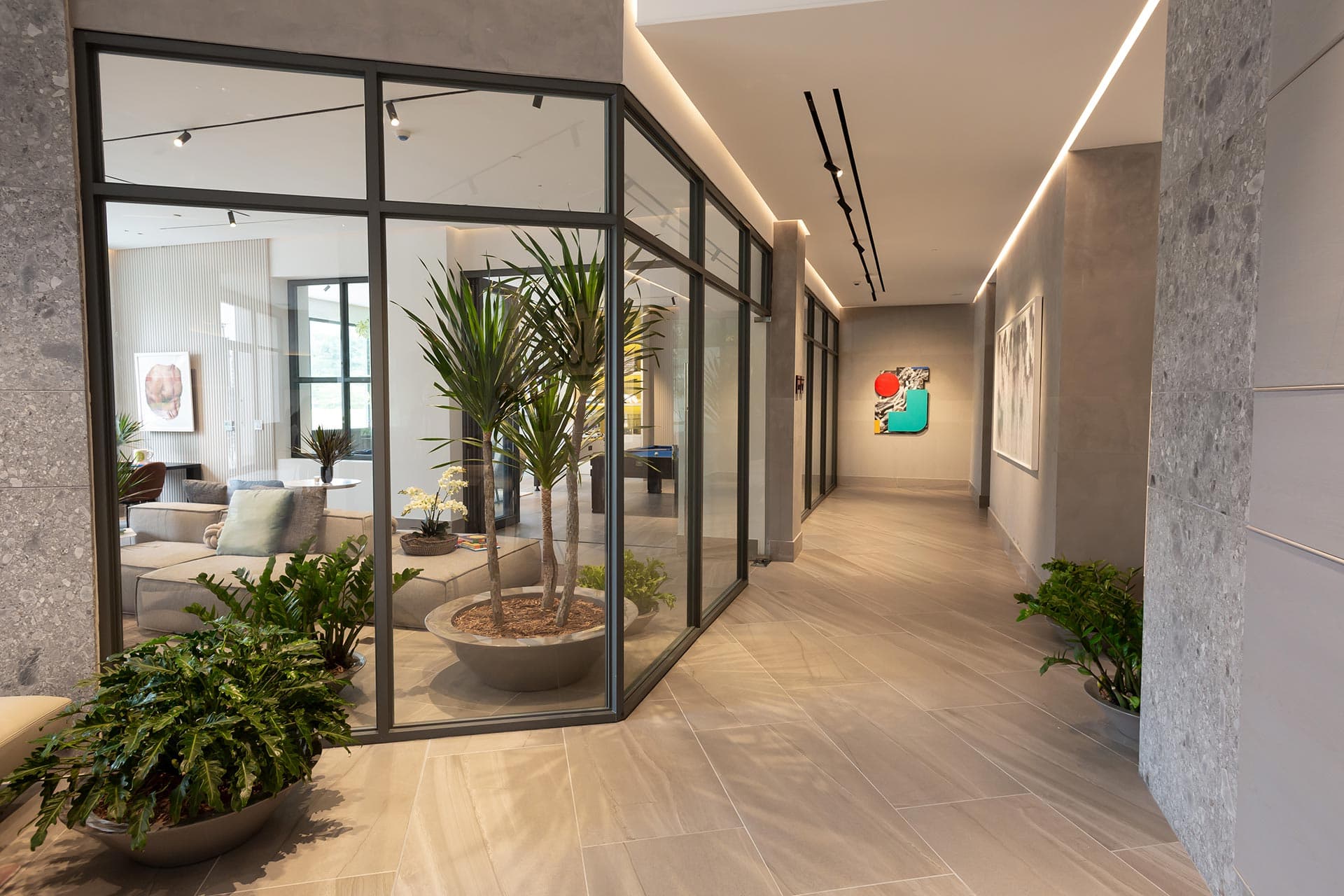 Glass-walled lounge corridor at Ocean House