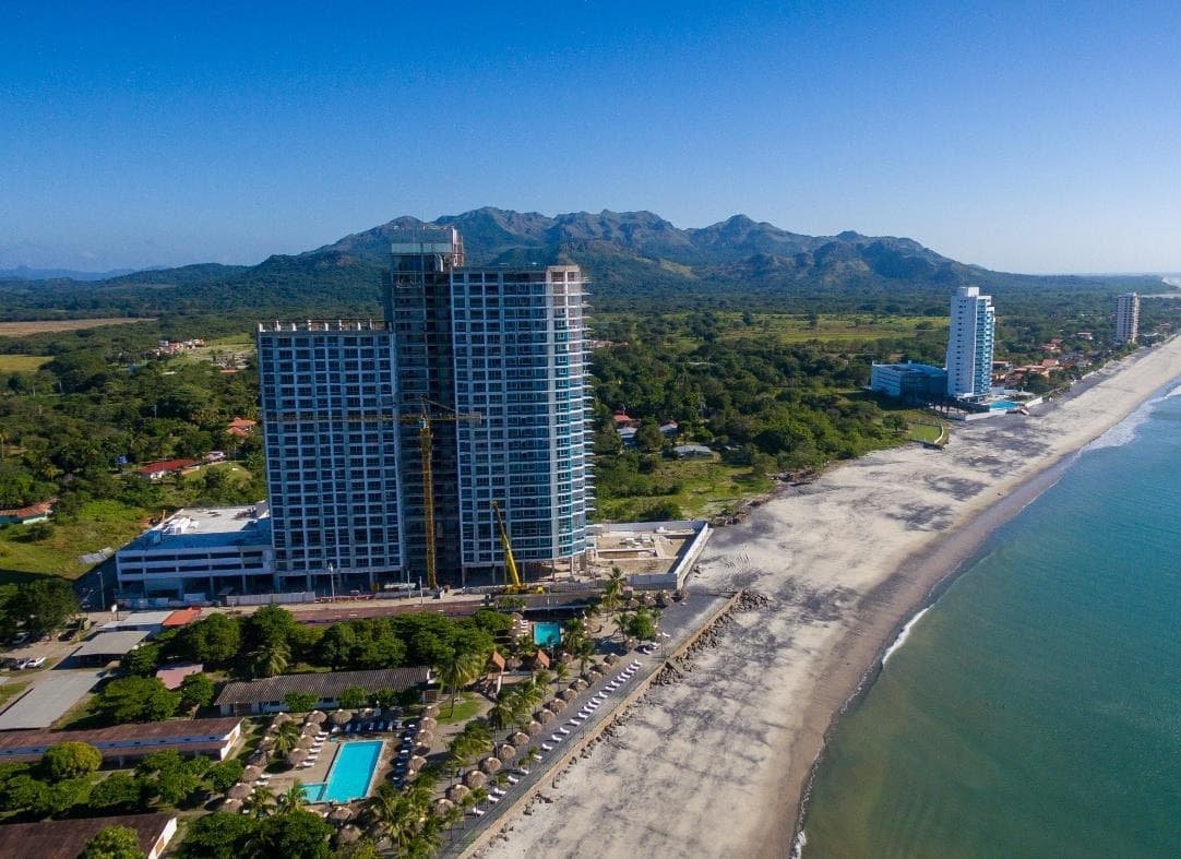 Aerial view of the Royal Palm twin towers with the mountains behind Gorgona beach