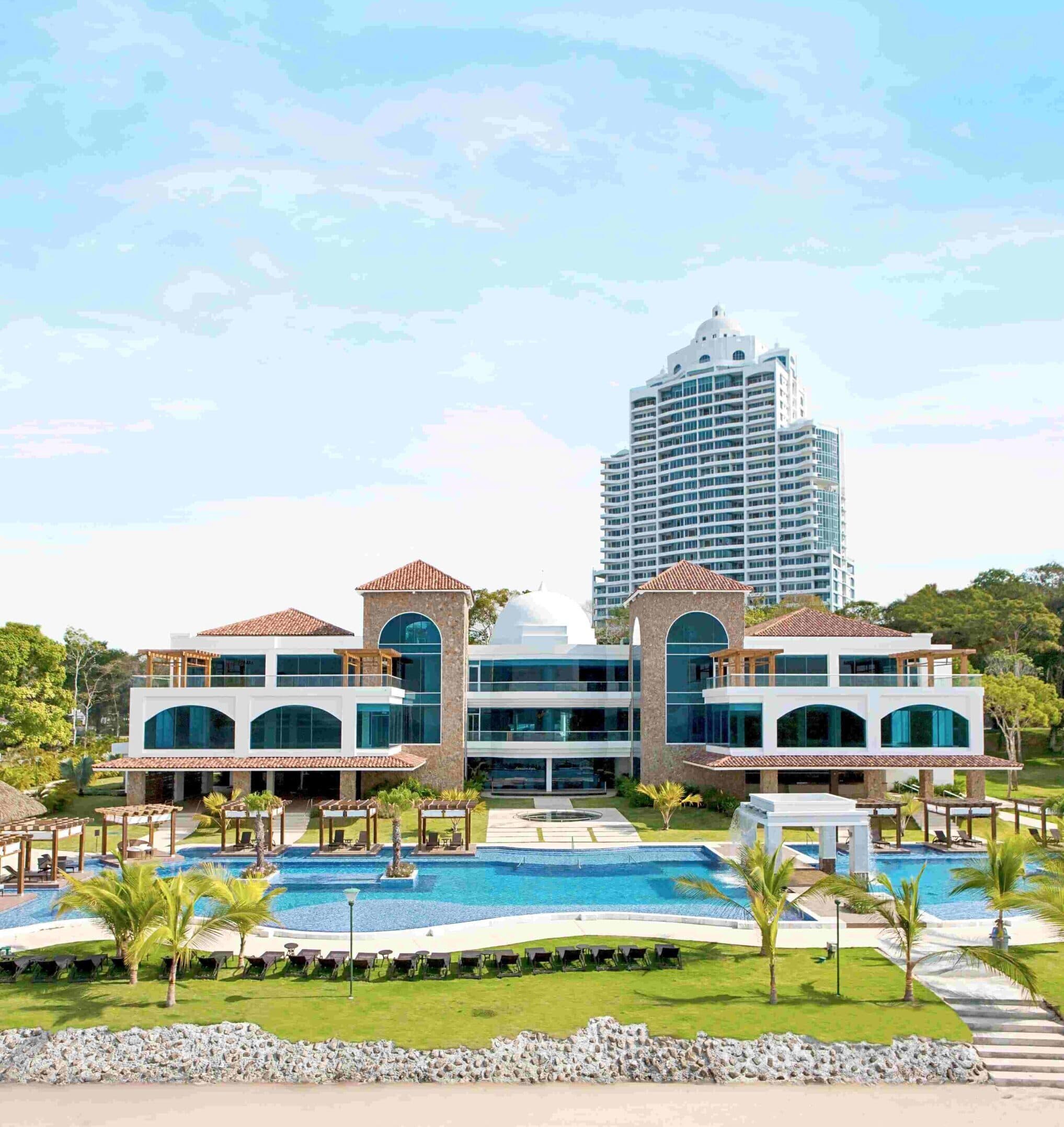 Casa Bonita tower rising behind The Pearl Club and its pool at Playa Bonita