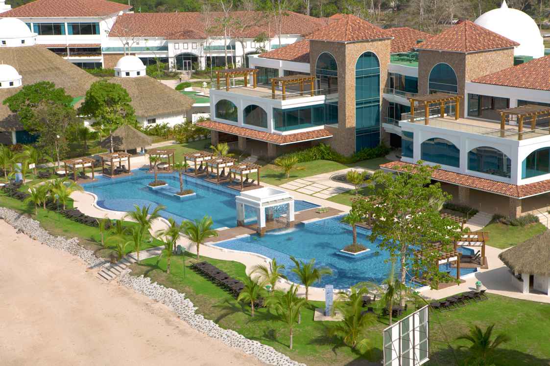 Aerial view of The Pearl Club pools and beach at Playa Bonita Residences, home of Casa Bonita