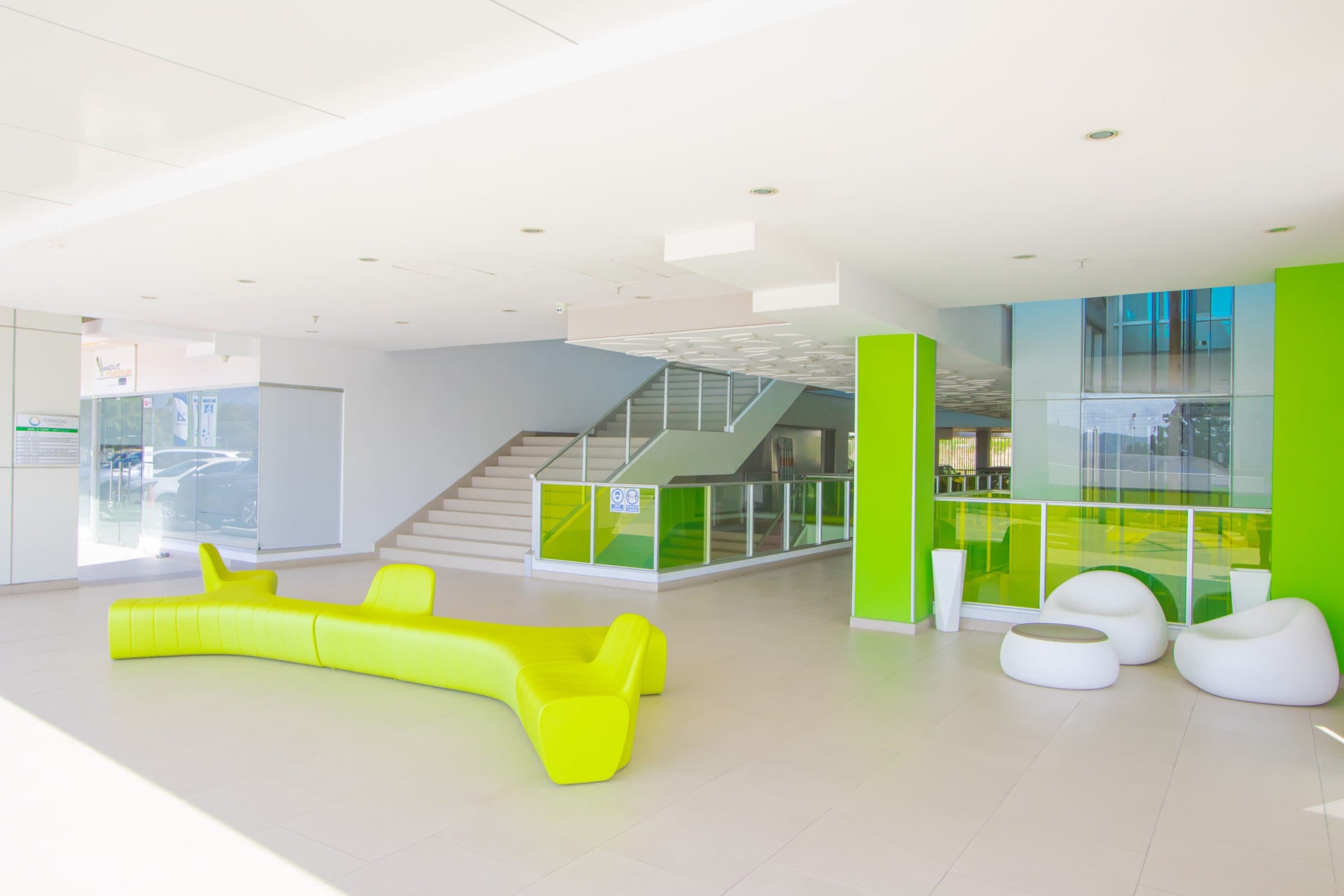 Lobby with stairs and lounge seating at Terrazas de Albrook