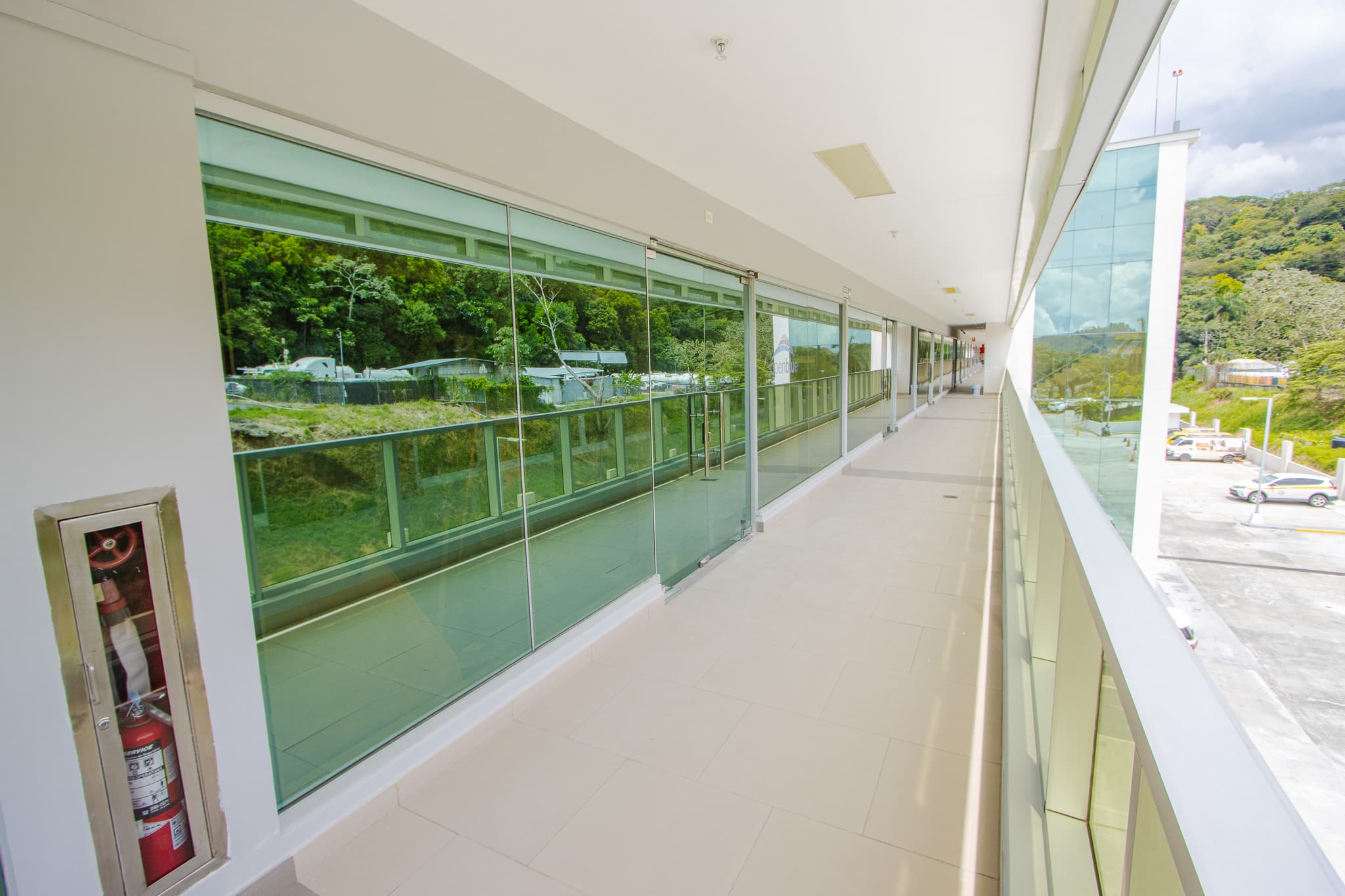 Glass-fronted commercial spaces along a Terrazas de Albrook walkway