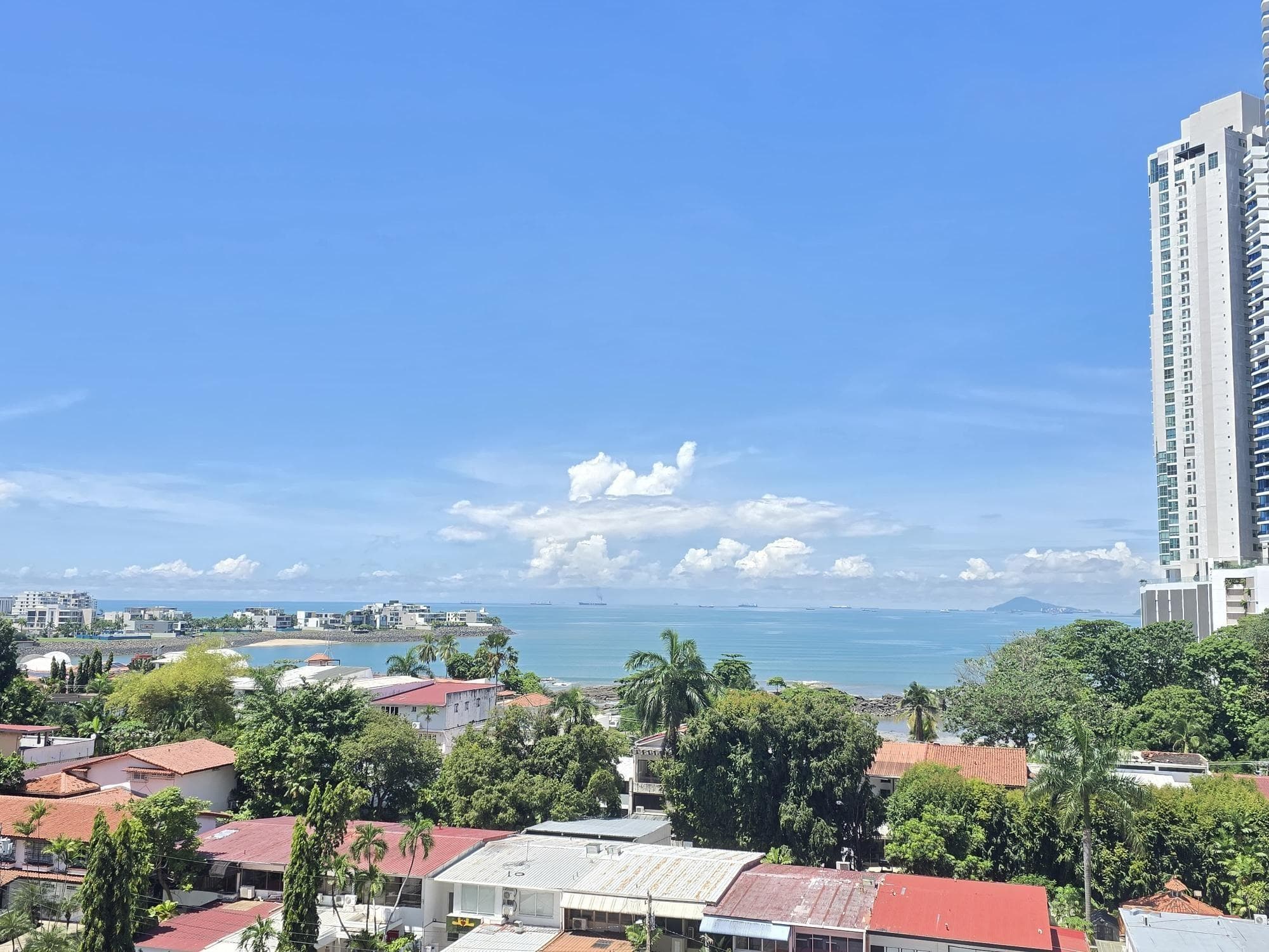Ocean and Paitilla rooftops seen from an upper floor of Pacific Sea, Punta Paitilla, Panama City