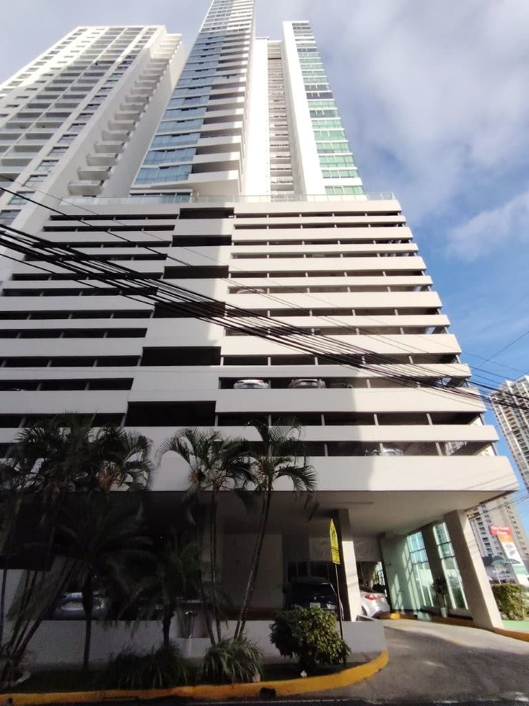 Street-level view of the PH WaterView tower above its landscaped entrance, San Francisco, Panama City