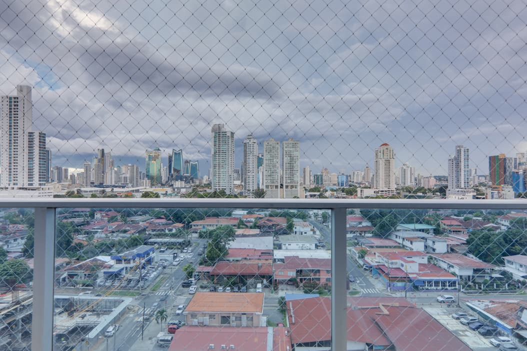 City skyline and San Francisco rooftops seen from a balcony at Harmony Tower, San Francisco, Panama City