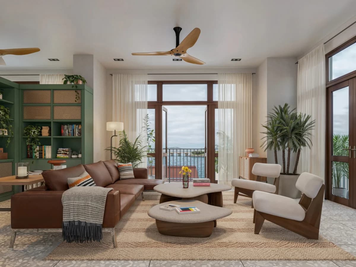 Living room with leather sofa and French doors to the balcony in a Doña Ceci type B apartment
