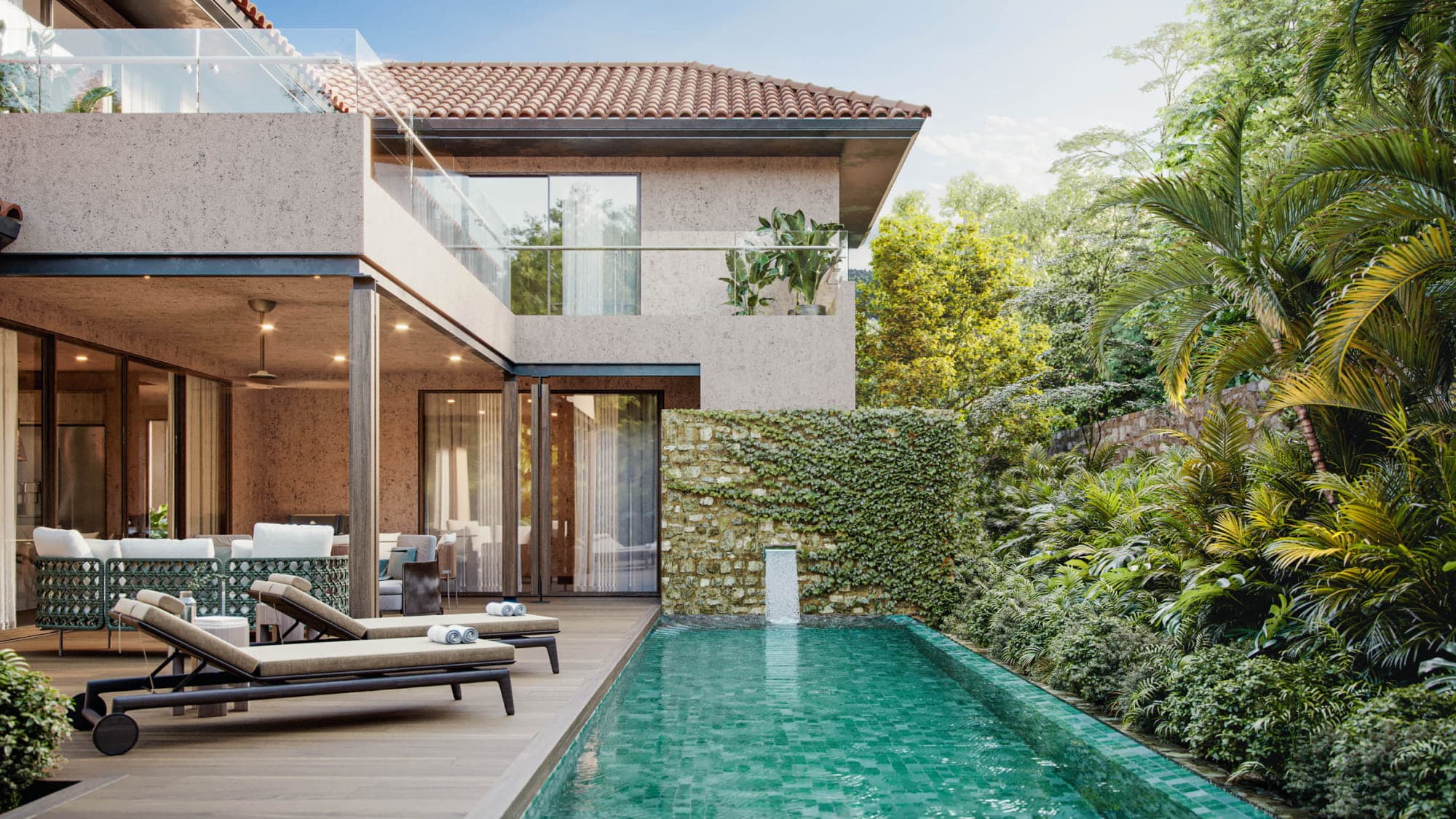 Lap pool and shaded terrace beside a green wall at an Andrómeda house