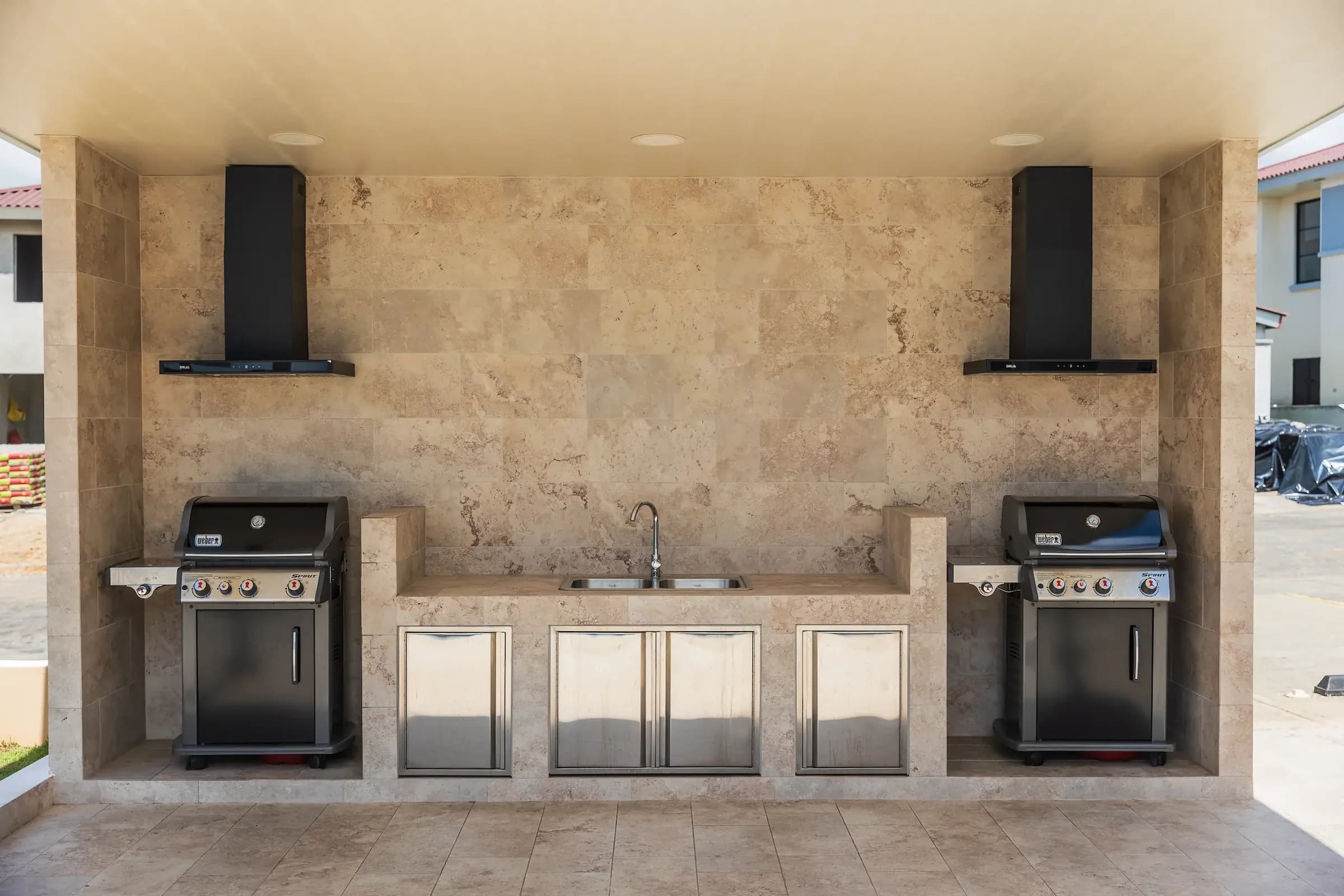 Outdoor barbecue area with two grills in the Arcadia social area, Costa Verde