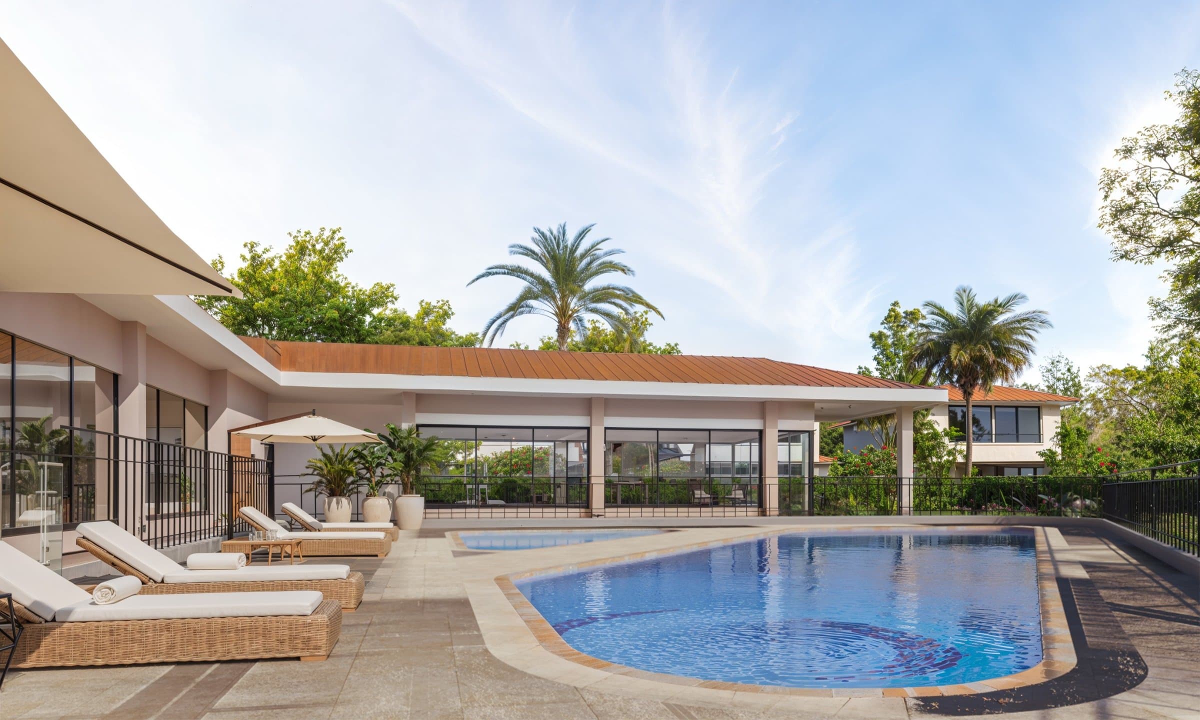 Alborada community pool and clubhouse with sun loungers