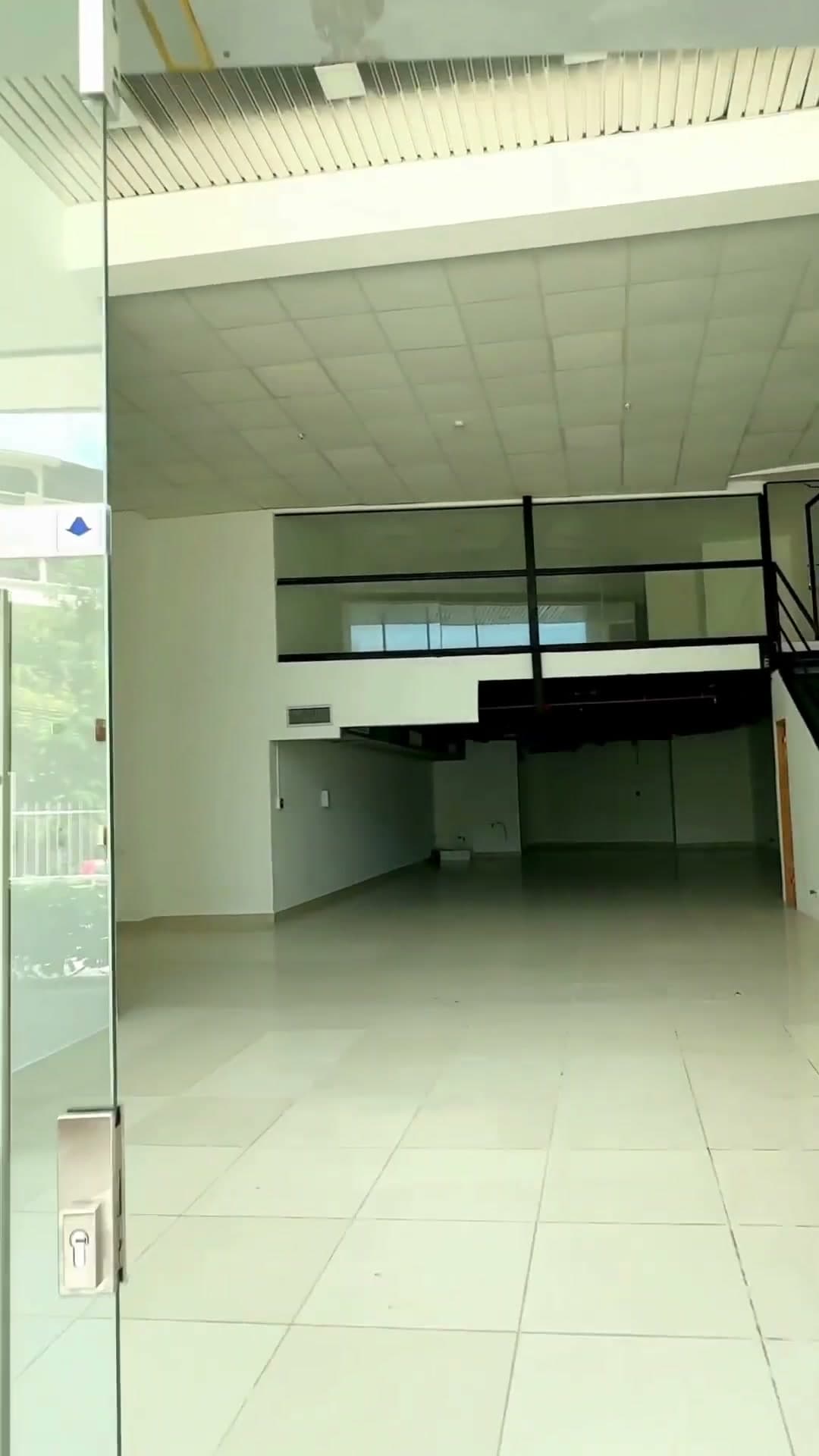 Empty commercial unit with glass front and mezzanine at Allure at the Park — Park Shops