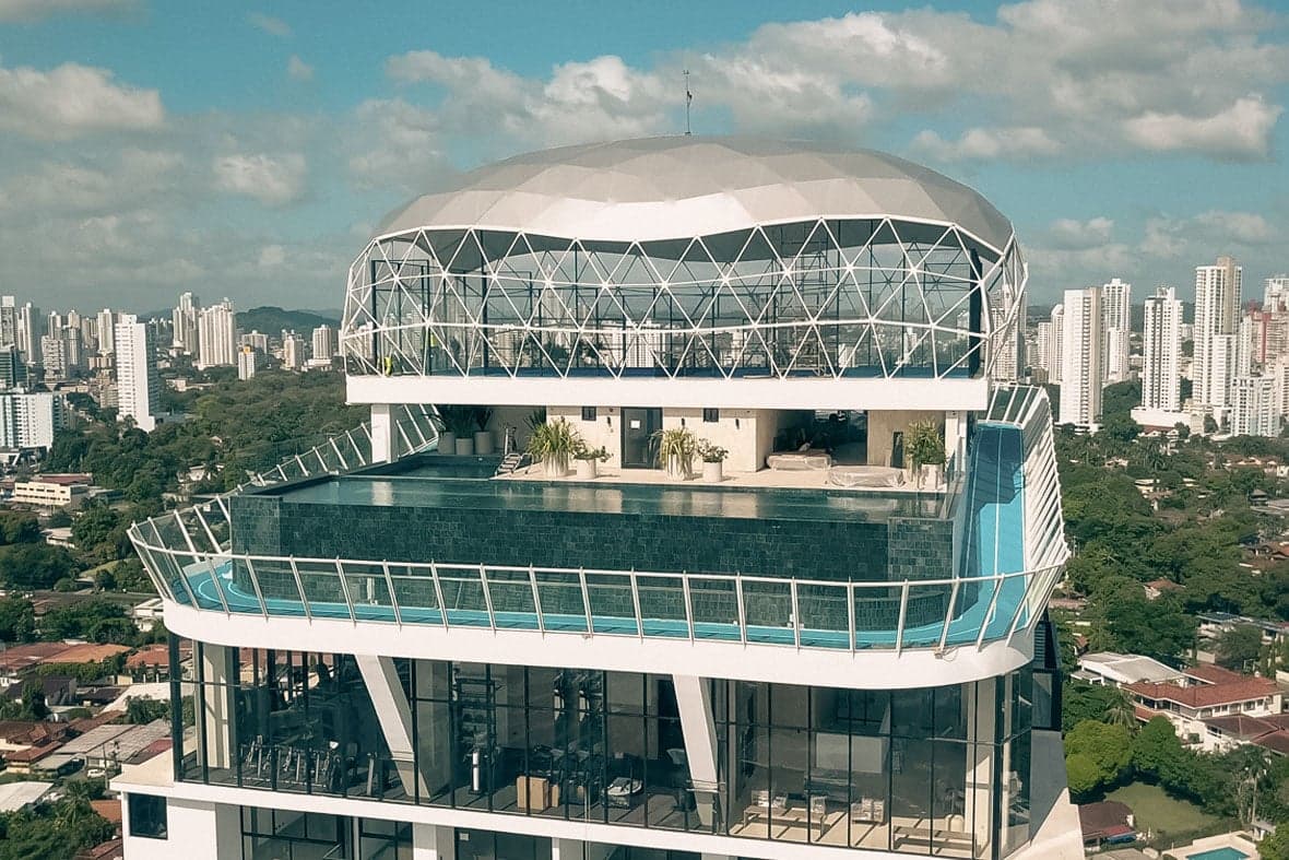 Aerial view of the Victory Wellness rooftop pool and glass dome above Coco del Mar