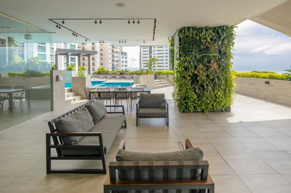 Covered lounge terrace beside the pool on the amenity level of Vita