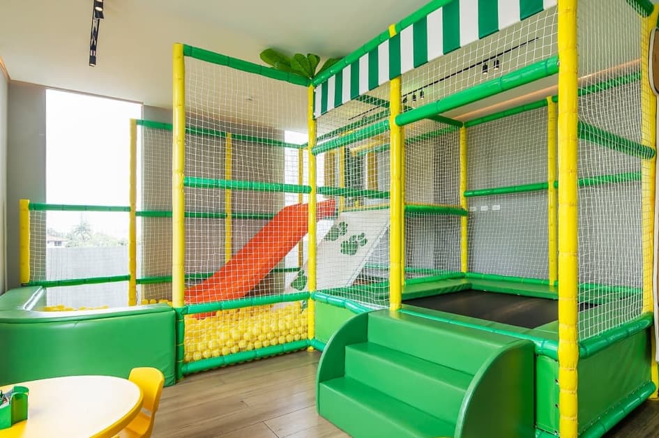 Indoor play structure with ball pit in the kids' room at Vita