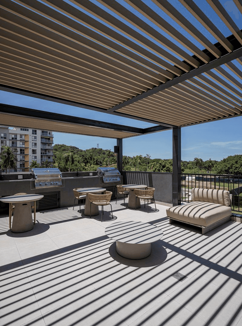 BBQ terrace with pergola and lounge seating at Cëntriqo