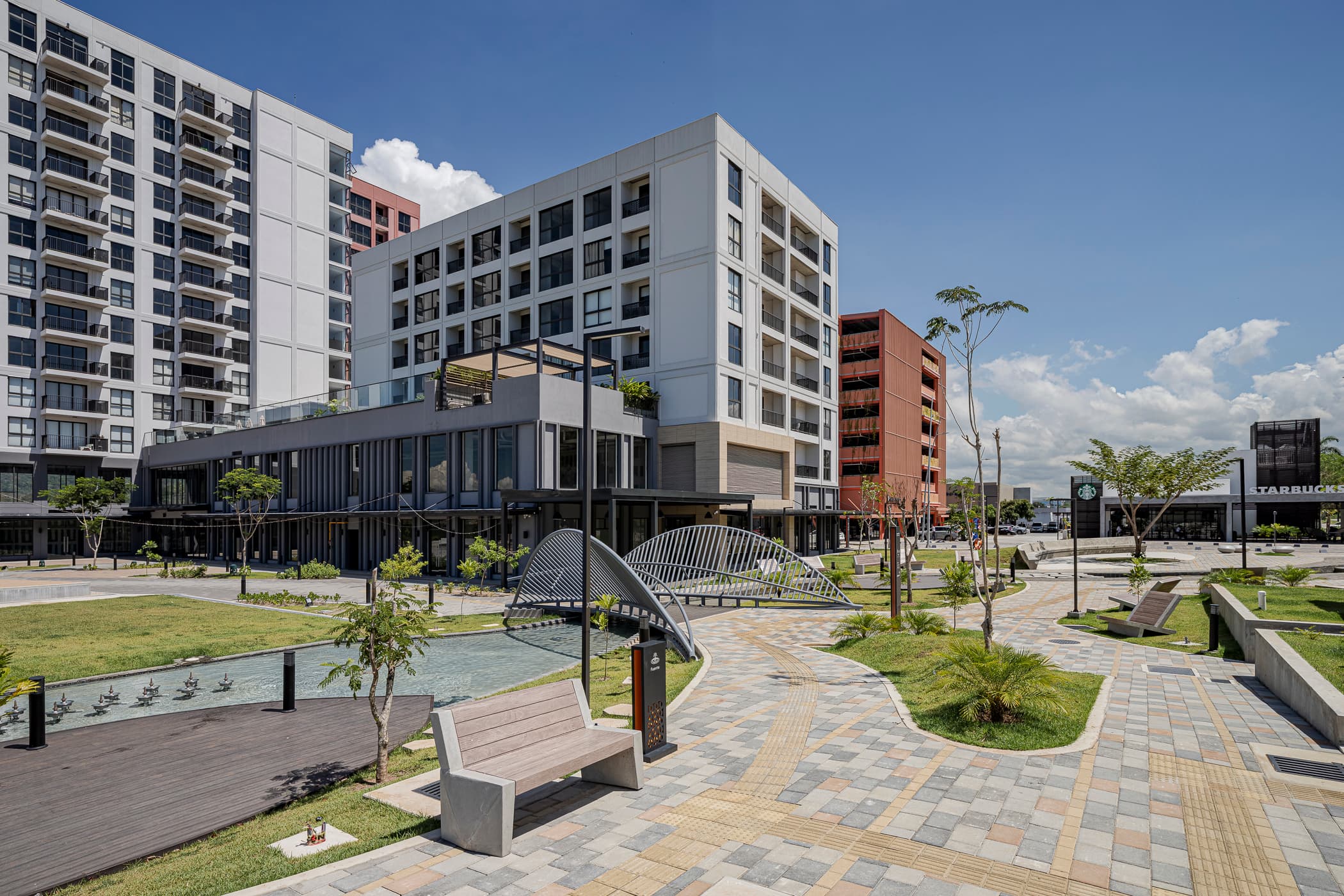 Cëntriqo apartment buildings and landscaped plaza in Panama Pacifico