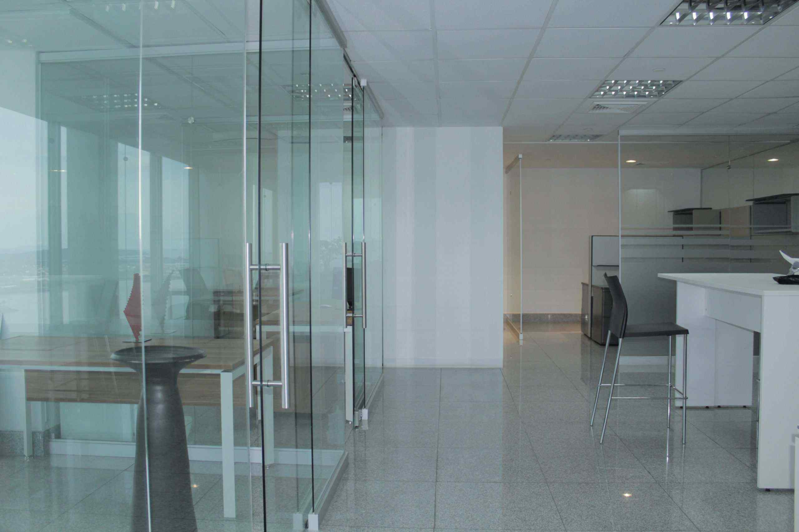 Glass-partitioned office at BICSA Financial Center