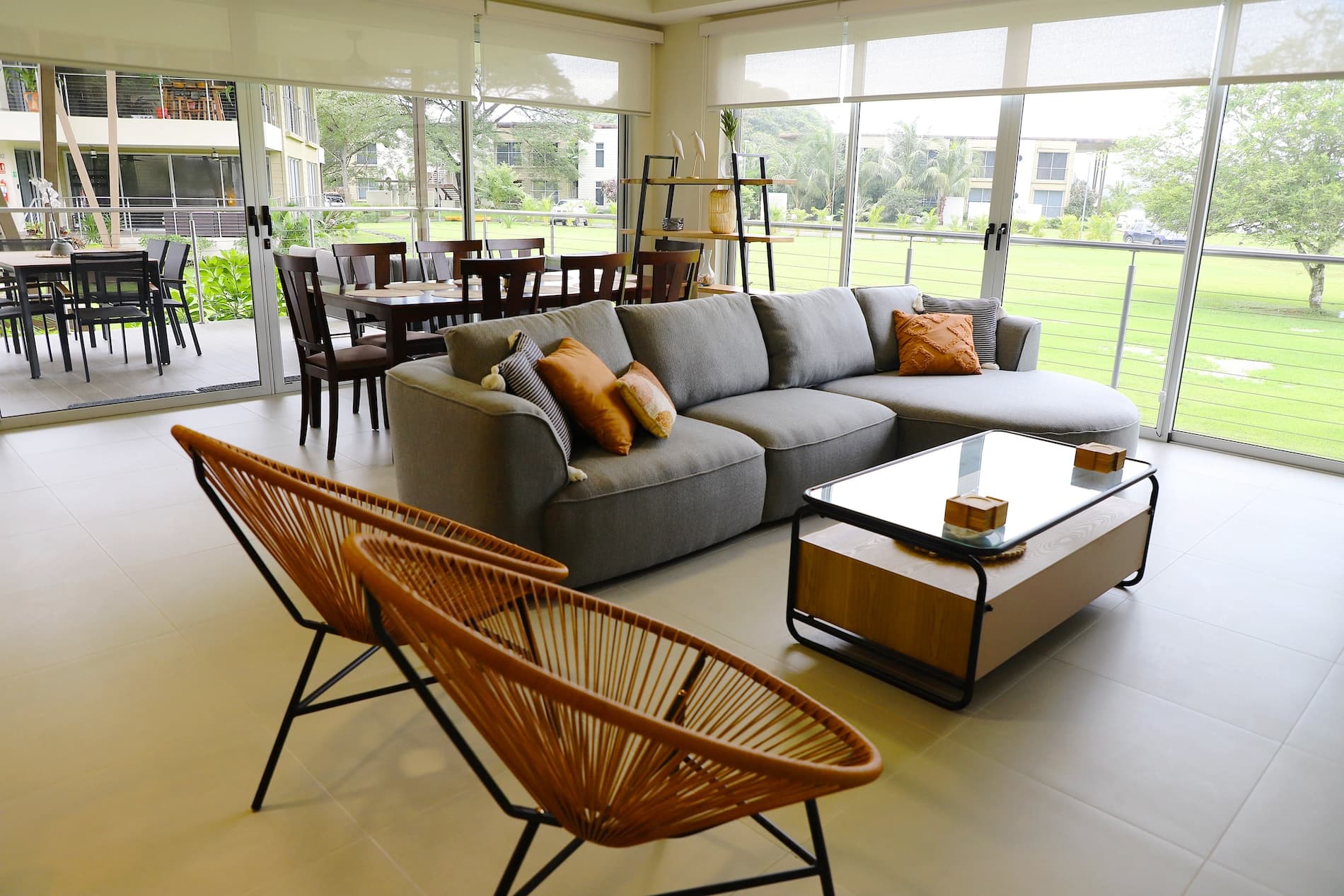 Open-plan living room with glass doors to the garden in a Villa Marina condo