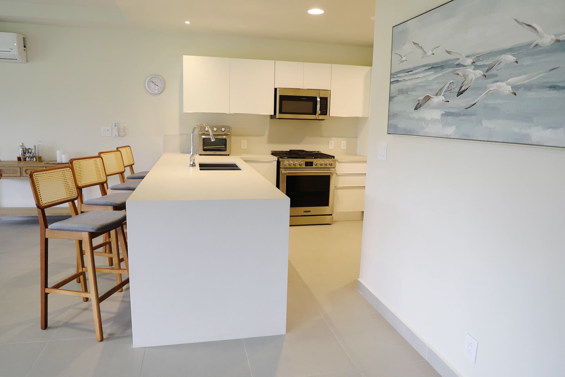 White kitchen with breakfast bar in a Villa Marina condo