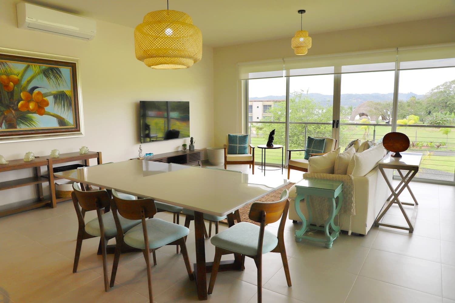 Dining area and living room with garden views in a Villa Marina condo