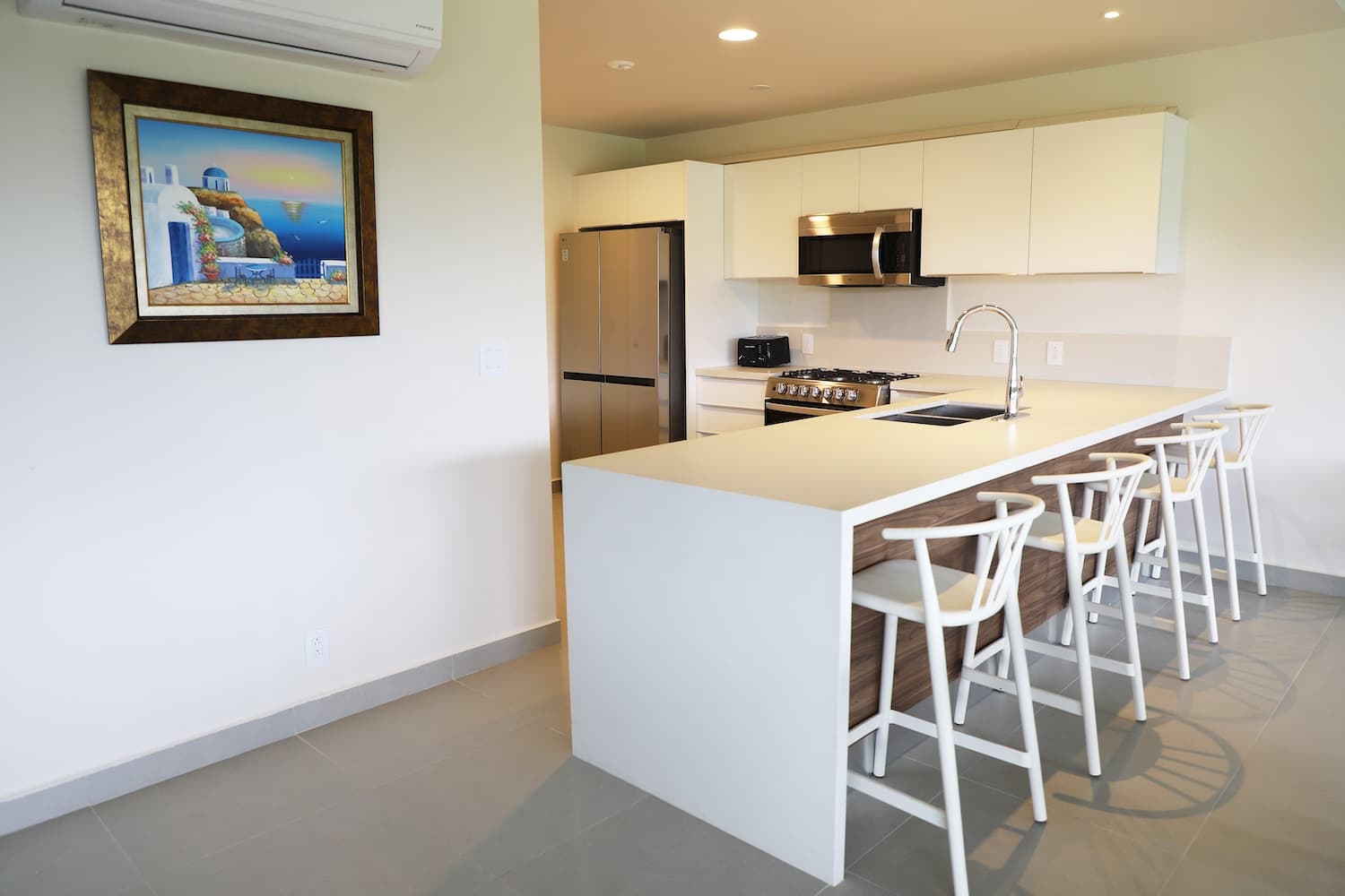 Kitchen island with bar stools in a Villa Marina condo