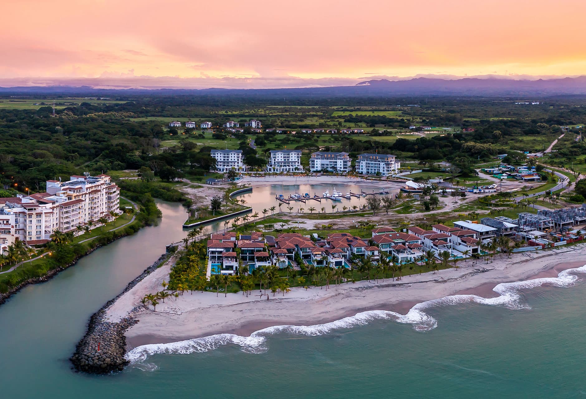 Aerial view of the Buenaventura coast with Marina Village, the marina channel and the beach, home of Marine Lodge