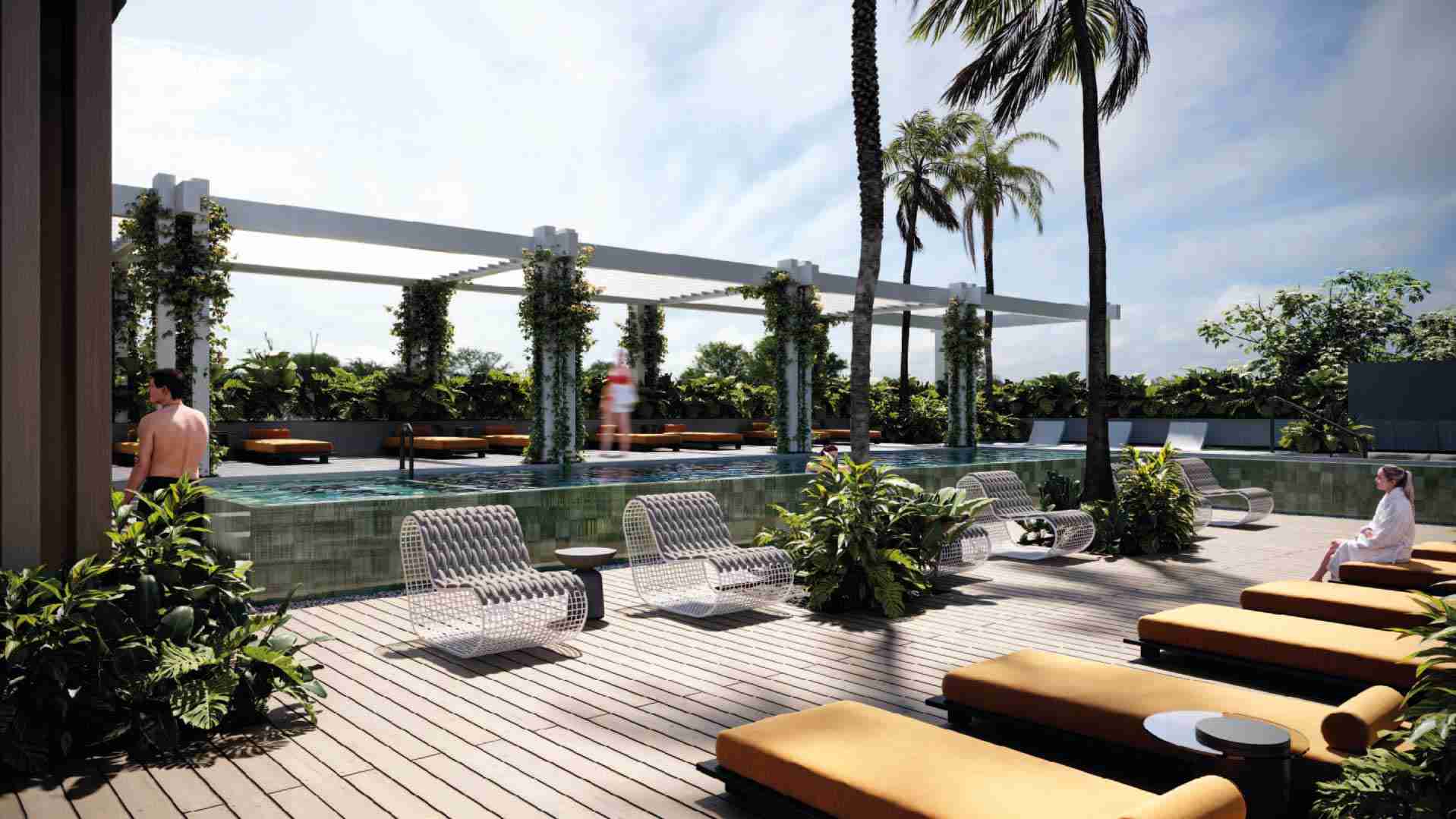 Pool deck with sun loungers and pergola at Ventu Homtel