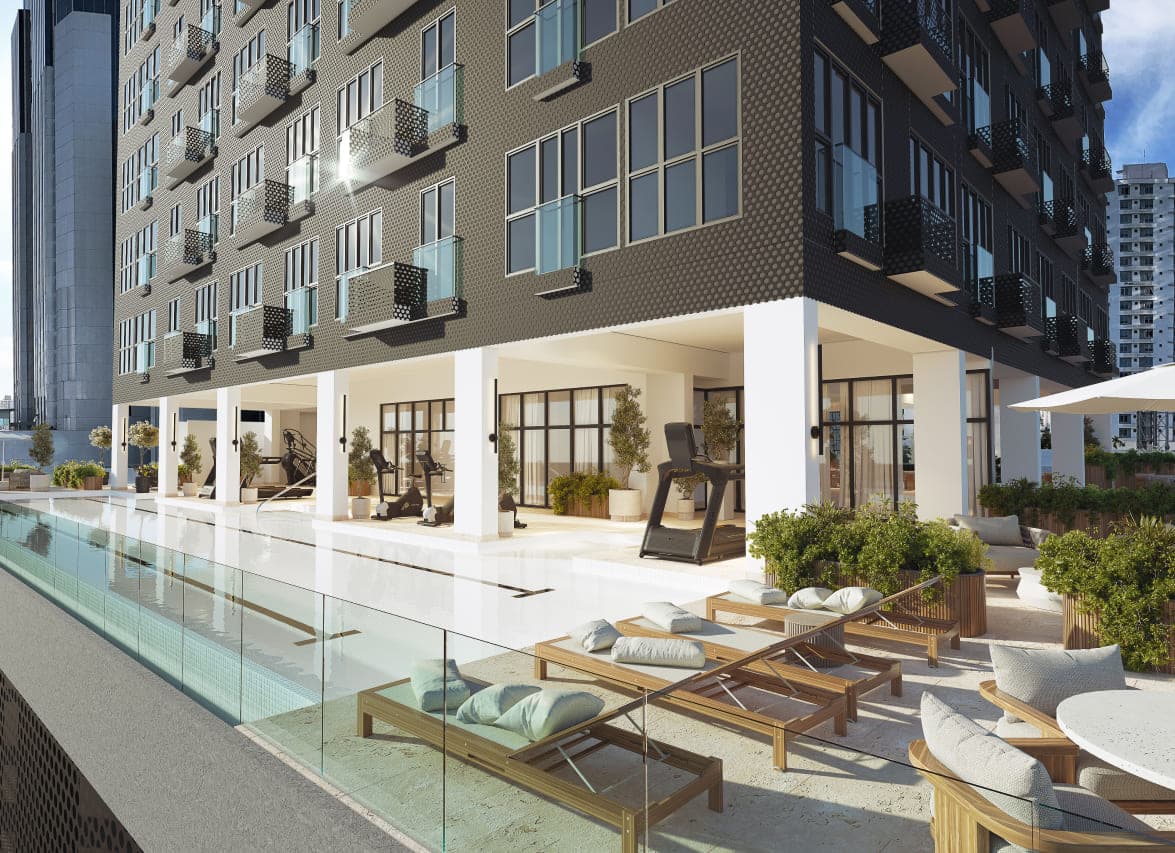 Pool deck with loungers at The Walker Wellness Center