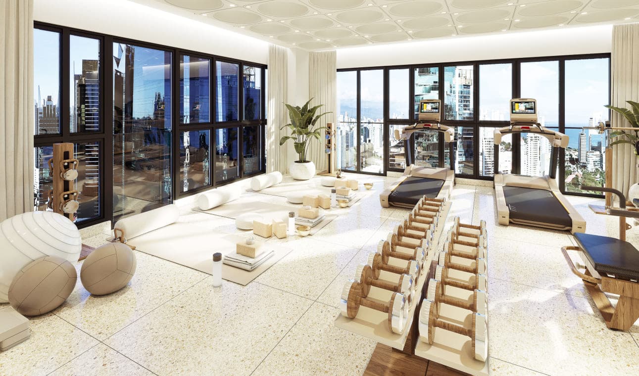 Gym with city views at The Walker Wellness Center