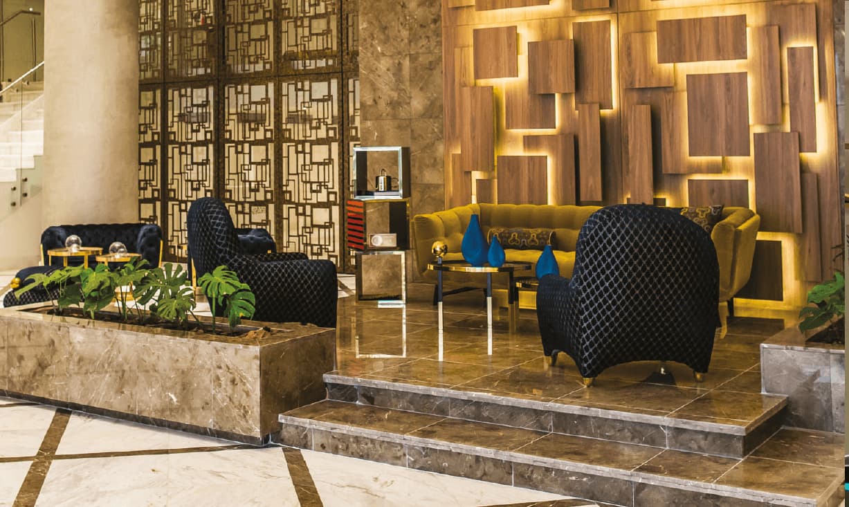 Deluxe Residences owners lounge with wood and marble finishes