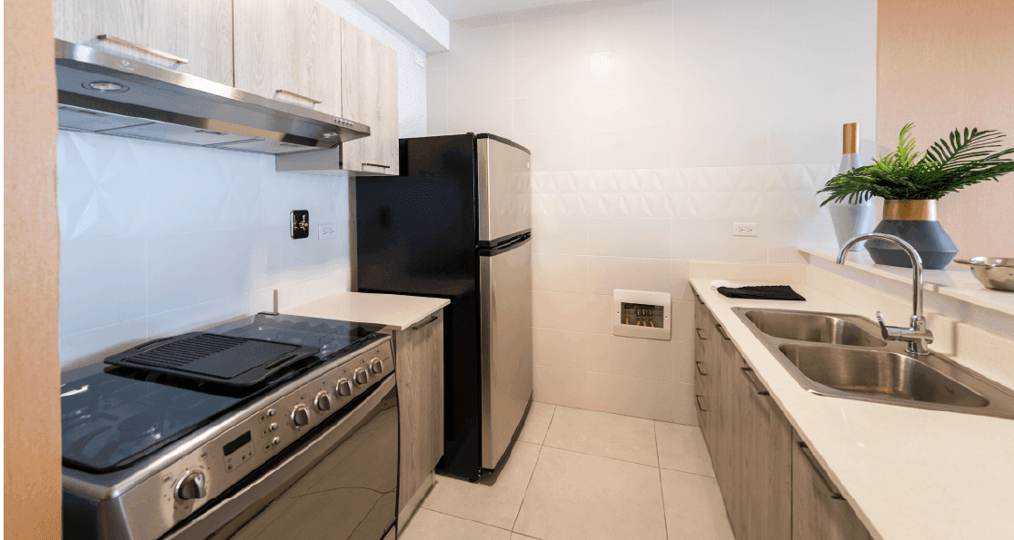Vivendi Green apartment kitchen with stainless steel appliances