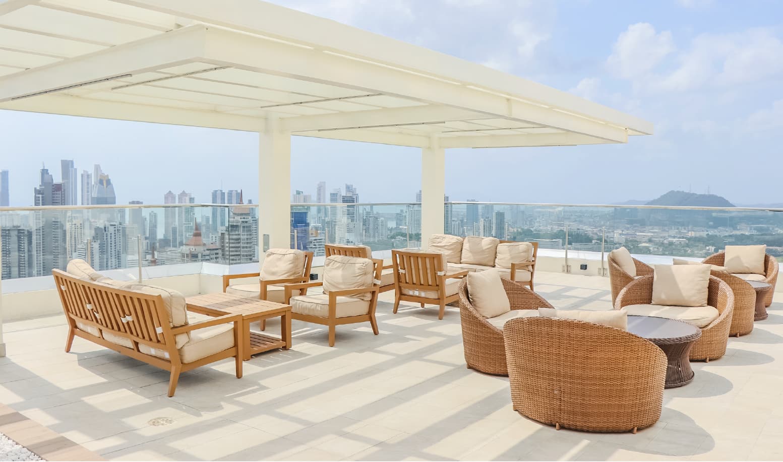 Pacific Park rooftop terrace with pergola and wicker seating