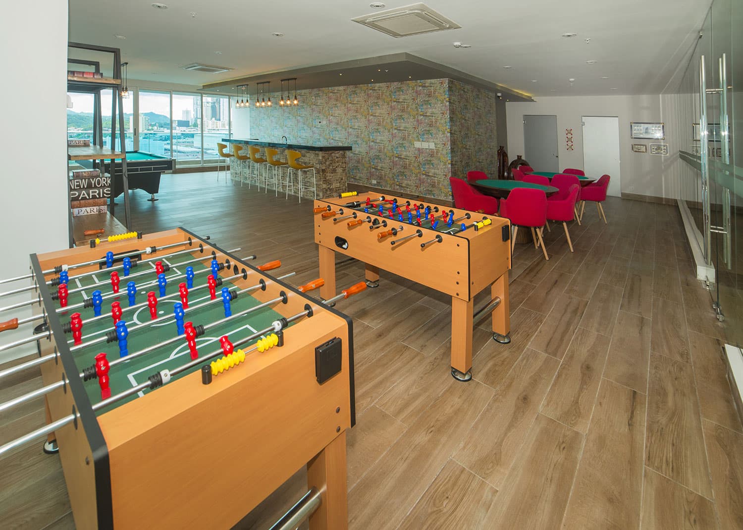 Elite 500 social area with foosball tables and card tables