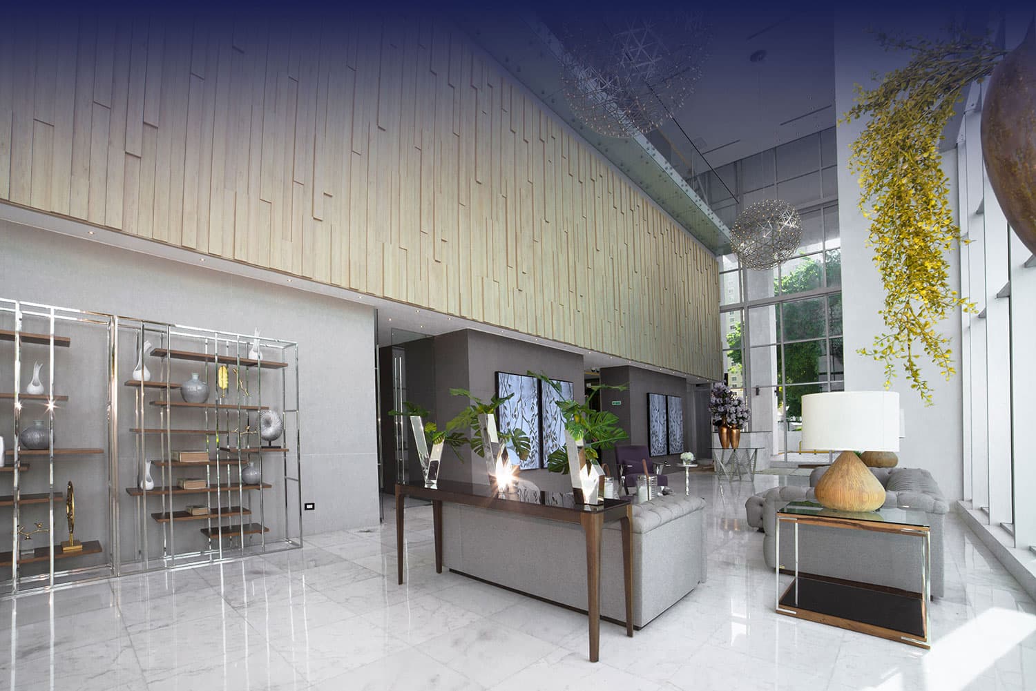 Elite 500 double-height lounge area with marble floors and wood-panel wall