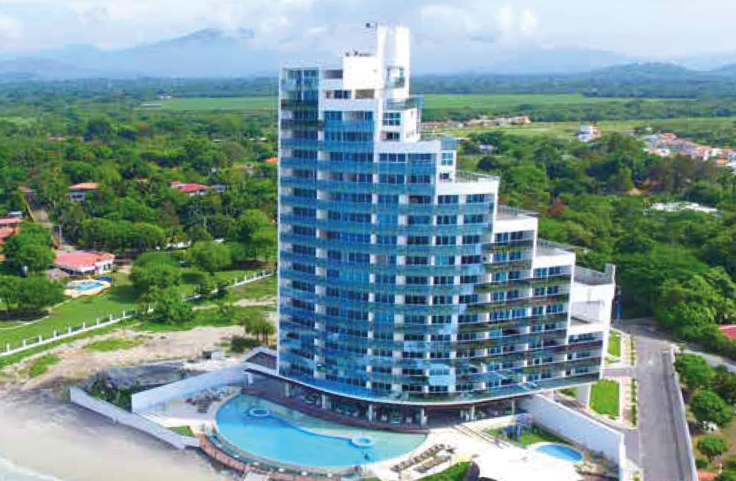 Ocean Waves aerial view of the tower, pools and surrounding greenery