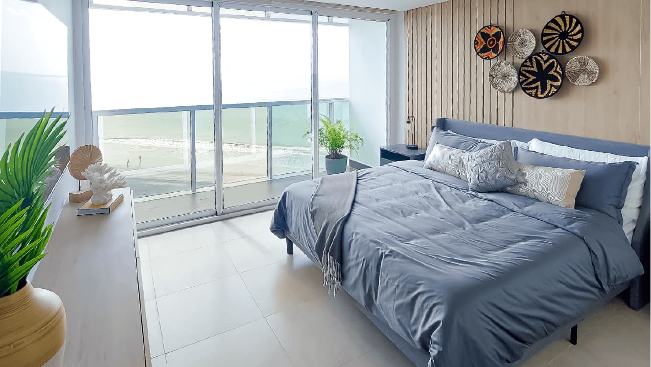 Ocean Waves apartment bedroom with ocean-view balcony